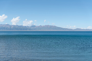 Calm surface of the lake with a sunny day. Shot in Sayram Lake in Xinjiang, China.