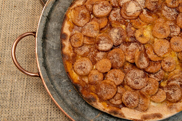 Sweet Brazilian pizza with banana, cinnamon and sugar