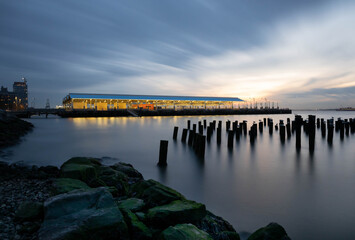waterfront Brooklyn pier at sunset, long exposure