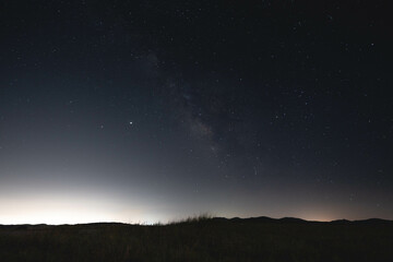 Fototapeta na wymiar Milky Way over Distant Mountains