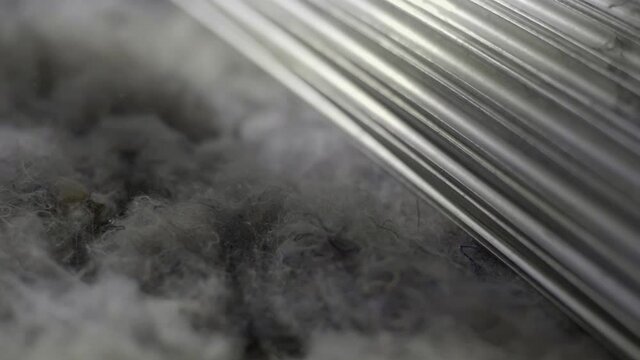 Closeup Of Recycled Textiles Manufacturing, Processed On A Industrial Spinning Machine