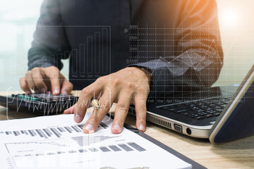 businessman working with business documents on wooden office table with computer notebook and calculator