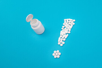 Global Pharmaceutical Industry and Medicinal Products - Exclamation Point Made from White Pills and Tablets Lying on Blue Background