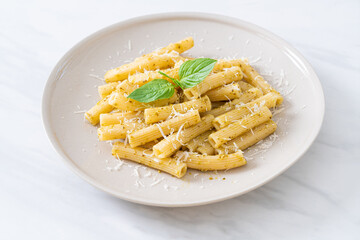 pesto rigatoni pasta with parmesan cheese