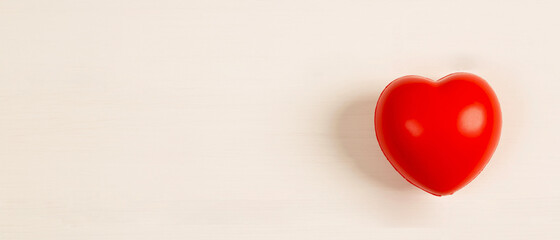 headphones and red hearts on white wooden background .health care and self-treatment from heart...
