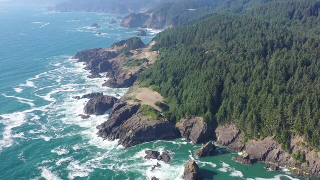 The cold Pacific Ocean washes against the scenic yet rugged coastline of southern Oregon. This beautiful region of the Pacific Northwest is accessible via highway 101.