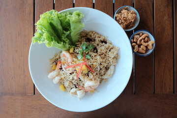 Mixed seafood fried rice with toppings cashew nuts, shredded pork.