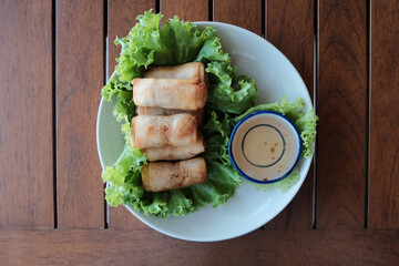 Fried spring rolls with plum sauce.