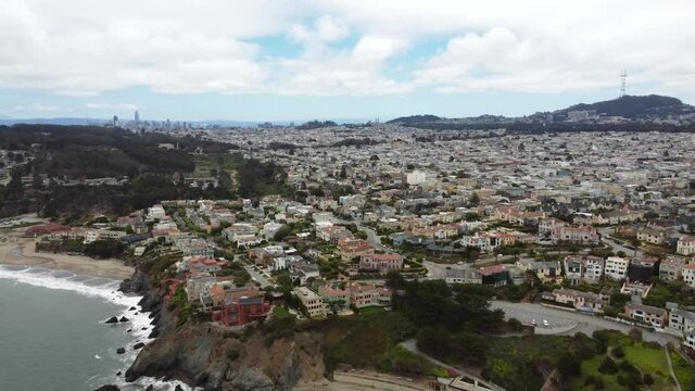 4K 30fps Aerial Drone Footage Of The California Coast Near Presidio Neighborhood Sea Cliff Town And Beach With San Francisco City Skyline In The Background, Coastal Waves Crashing Sandy China Beach