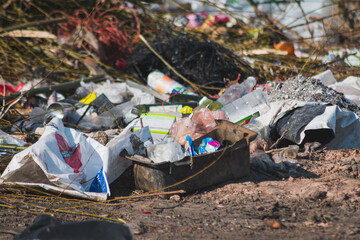 Plastic waste, bottles, cans, ropes, bags in the garbage dump
