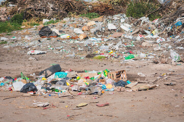 ccumulated waste. Damage to the environment. Plastics, bottles, cans, ropes, bags, branches, tires, boxes and more in the garbage dump