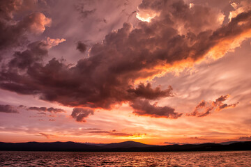 Scenic after-sunset crimson light on the lake