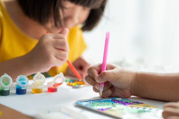 kid is painting color, education concept