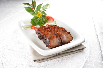Hong Kong Roasted bbq dark honey sweet pork belly meat char siew in white background asian banquet menu