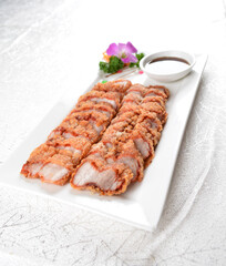 deep fried bbq crispy fragrant fat pork belly meat with chef sweet dark soy sauce in white background asian banquet menu