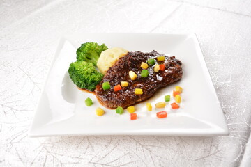 Grilled bbq black pepper pork chops fried with broccoli and beans in white background asian banquet menu