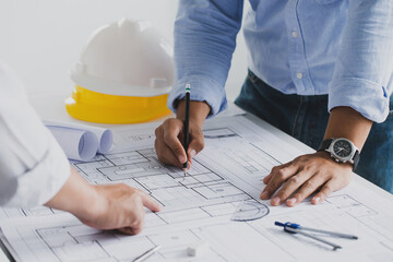 engineer meeting for an architectural project. working with partner and engineering tools working...