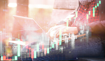 Young woman invests in cryptocurrencies using a laptop using a trading platform. Modern model of earning money by millenials people. Double exposure.