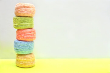 Threads, multicolored skeins of thread for needlework, background with skeins of thread.