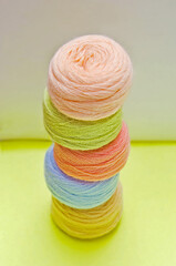 Threads, multicolored skeins of thread for needlework, background with skeins of thread.