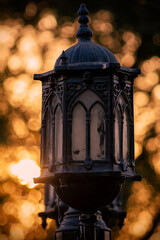 Fototapeta premium Vintage Street Lamp With Golden Bokeh in Background