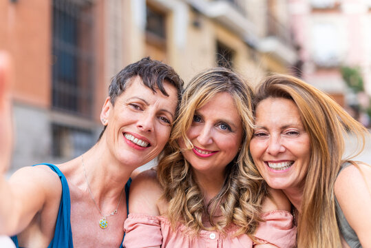 Portrait Of Three Adult Female Friends Taking A Selfie In The City