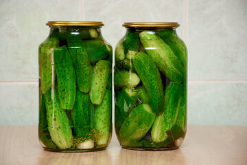 home canned sweet pickles made from family farm fresh vegetable garden cucumbers displayed on a rustic background