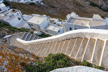 Serifos island, Cyclades Greece. High angle view of stone stairs over Chora sunny day. - obrazy, fototapety, plakaty
