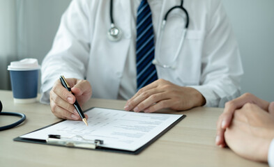 Man doctors explain and recommend treatment after a female patient meets a doctor and receives results regarding illness problems. Medical and health care concepts