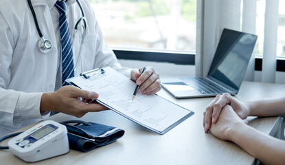 Man doctors explain and recommend treatment after a female patient meets a doctor and receives results regarding illness problems. Medical and health care concepts