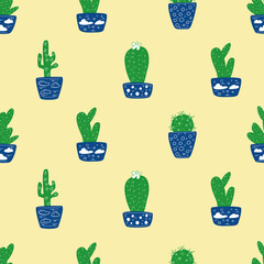 Cacti in blue pots on a sandy background.