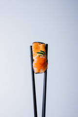 sushi with chopsticks