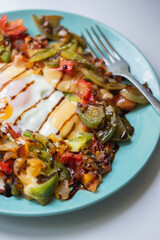 healthy breakfast. fried egg and vegetables, pepper, tomatoes