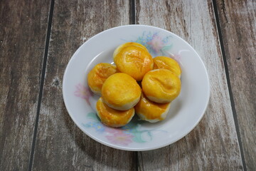 Pile of Traditional Chinese pastry serving on the plate. Famous classic moon cake festival concept. 