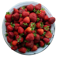 ripe strawberries are lying in a bowl on a white background