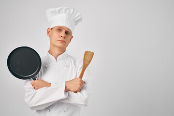 chef bet with beard in hand kitchen utensils restaurant professional
