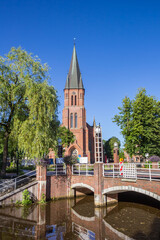 Fototapeta na wymiar Historic Antonius church at the canal in Papenburg, Germany