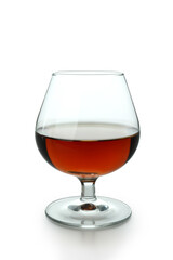 Glass of cognac isolated on white background