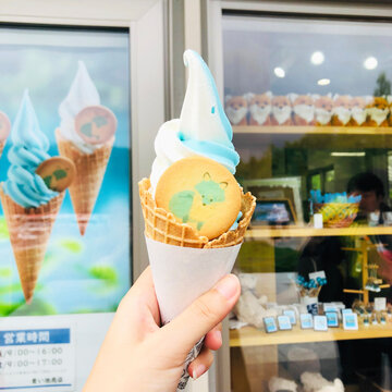 blue white ice cream cone with biscuit