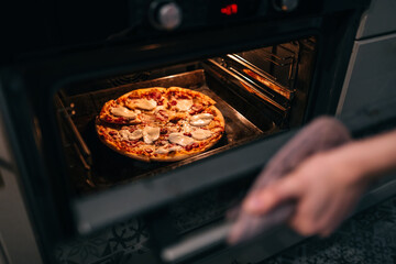 Cooking homemade pizza in the oven.