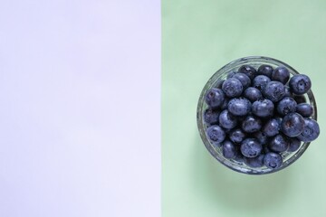 Yogurt and fresh blueberries, background. Flat lounger, top view, copy space
