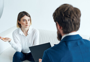 man and woman communicate work team documents