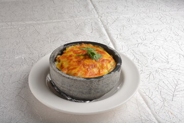 baked cheese creamy seafood meat fried rice in stone bowl in white background asian halal menu