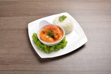 cook braised nonya red curry chicken serve with steamed jasmine white rice main course in wood background asian halal menu