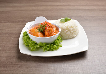 cook braised nonya red curry chicken serve with steamed jasmine white rice main course in wood background asian halal menu