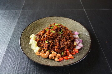 vegan healthy olive fried rice with mixed nut and onion chilli in black background asian halal menu