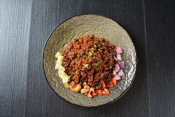 vegan healthy olive fried rice with mixed nut and onion chilli in black background asian halal menu