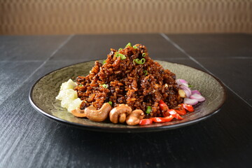 vegan healthy olive fried rice with mixed nut and onion chilli in black background asian halal menu