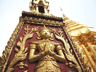 Fototapeta na wymiar Artist at wall of temple beautiful gold pagoda in Thailand Chiangmai February 2019,Culture of Thailand people