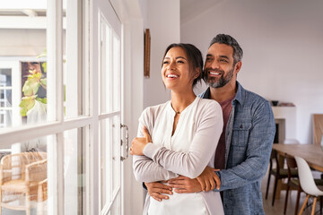 Mature multiethnic couple thinking about their future family - Powered by Adobe